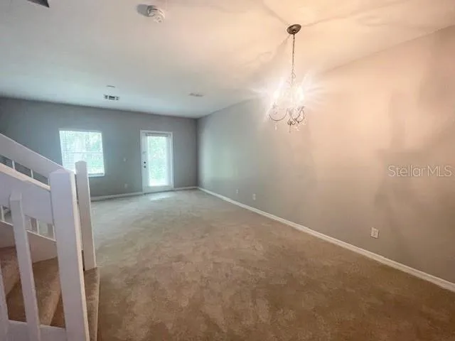 a view of a room with window closet and windows