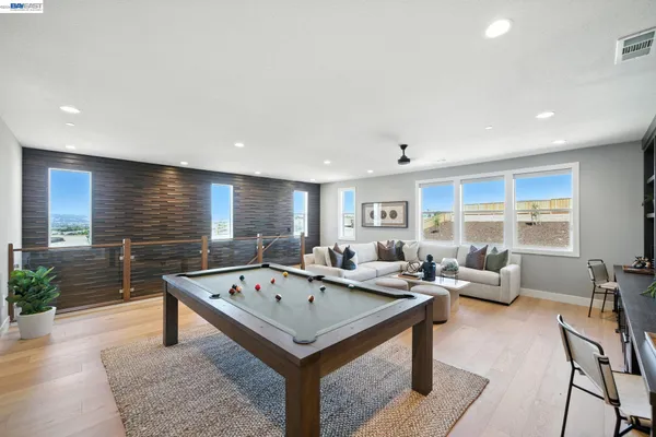 a bedroom with a bed and a large mirror