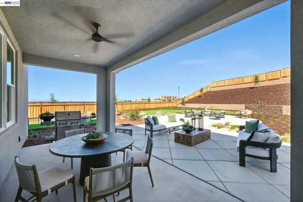 a view of a dining room with furniture and window