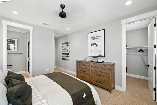 a bed room with a bed and a chandelier