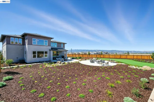 a view of a house with outdoor space and sitting area