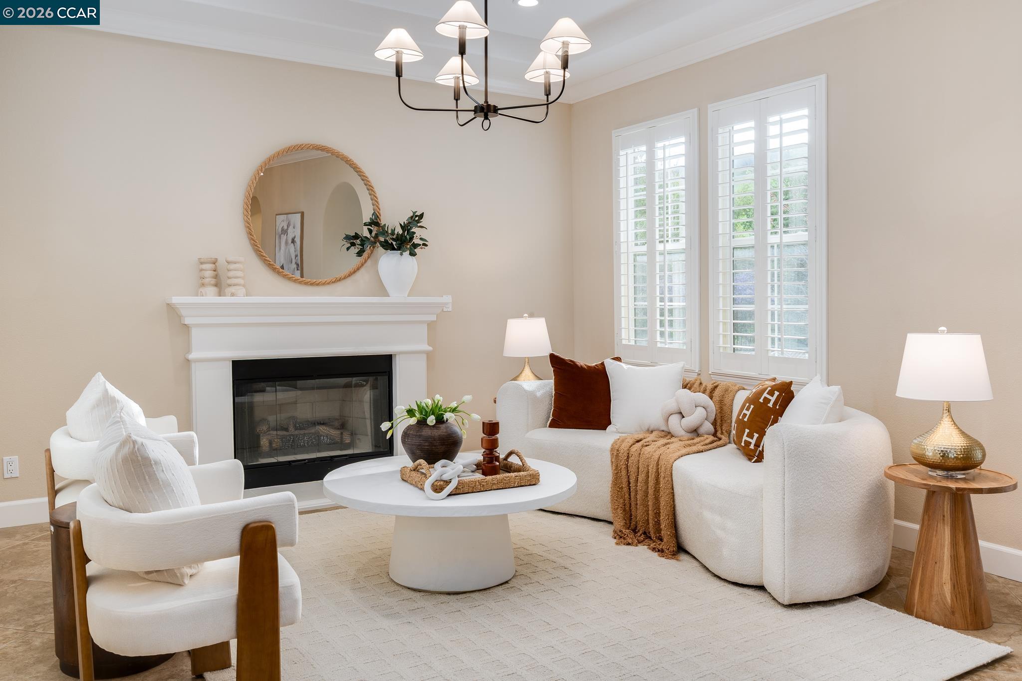 5058 Holborn Way San Ramon, CA 94582 - Photo 2 of 46 a living room with furniture a fireplace and a chandelier