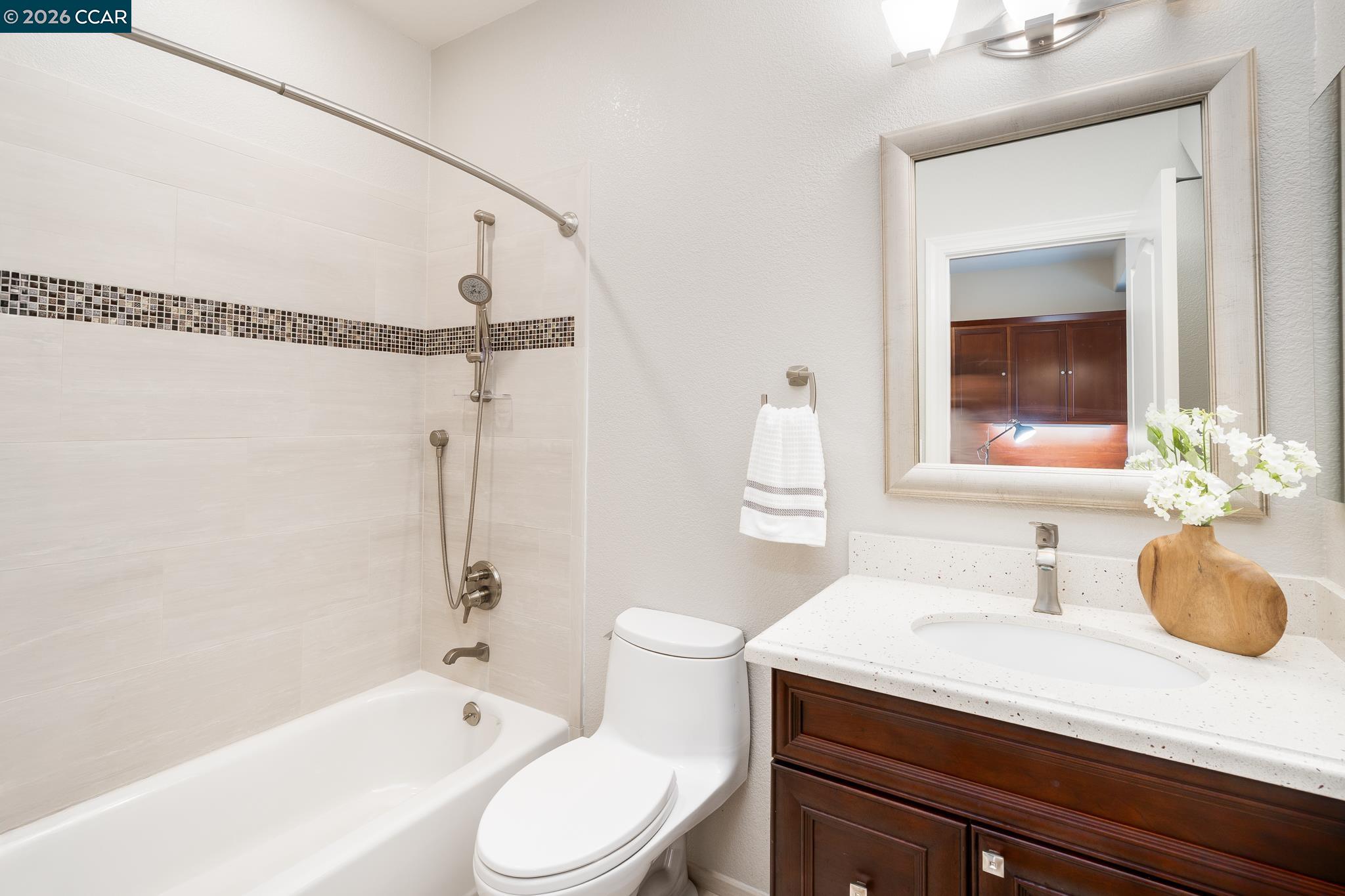 5058 Holborn Way San Ramon, CA 94582 - Photo 24 of 46 a bathroom with a sink a toilet and shower