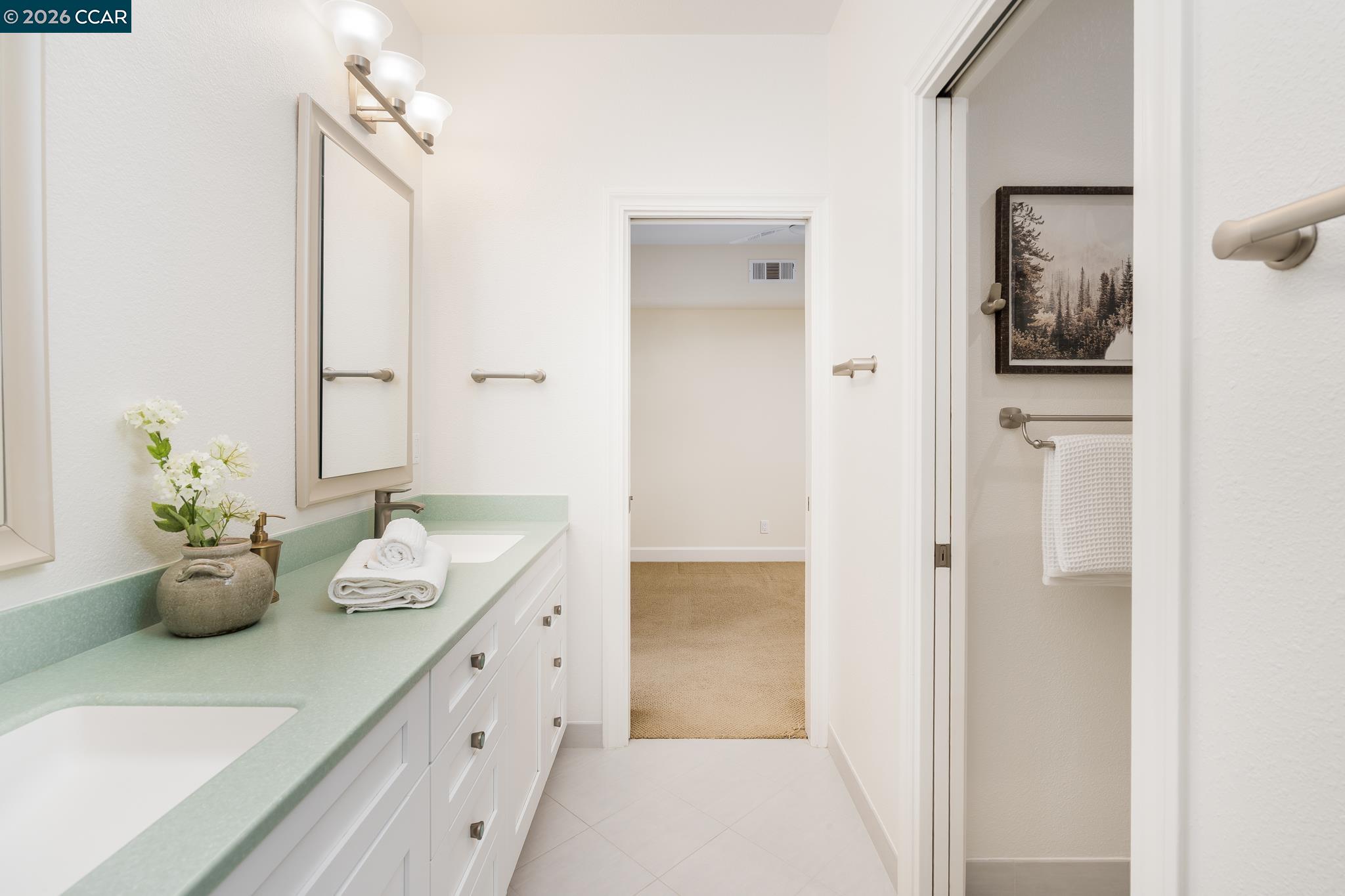 5058 Holborn Way San Ramon, CA 94582 - Photo 26 of 46 a bathroom with a granite countertop sink and a mirror