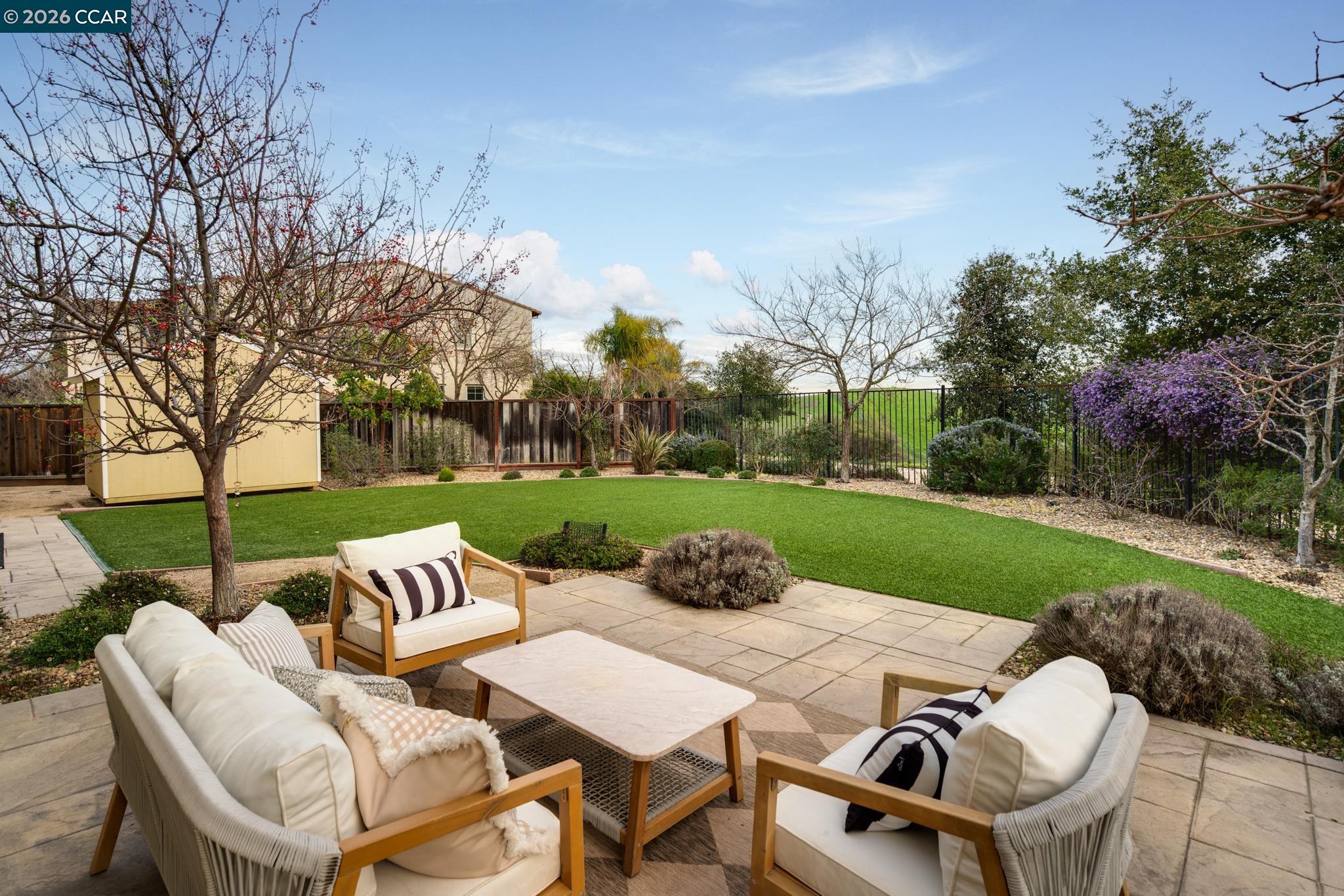 5058 Holborn Way San Ramon, CA 94582 - Photo 30 of 46 a view of a table and chairs in patio with wooden fence