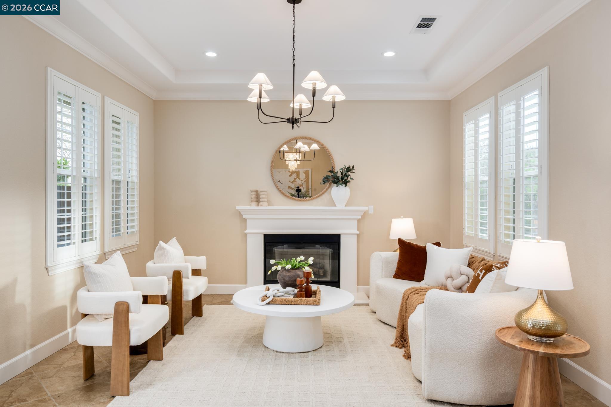 5058 Holborn Way San Ramon, CA 94582 - Photo 3 of 46 a living room with furniture chandelier and a fireplace