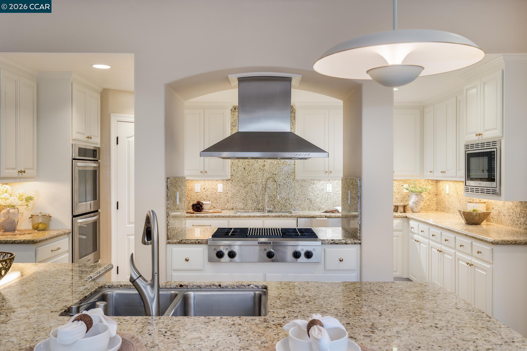 5058 Holborn Way San Ramon, CA 94582 - Photo 42 of 46 a kitchen with stainless steel appliances granite countertop a stove and a sink