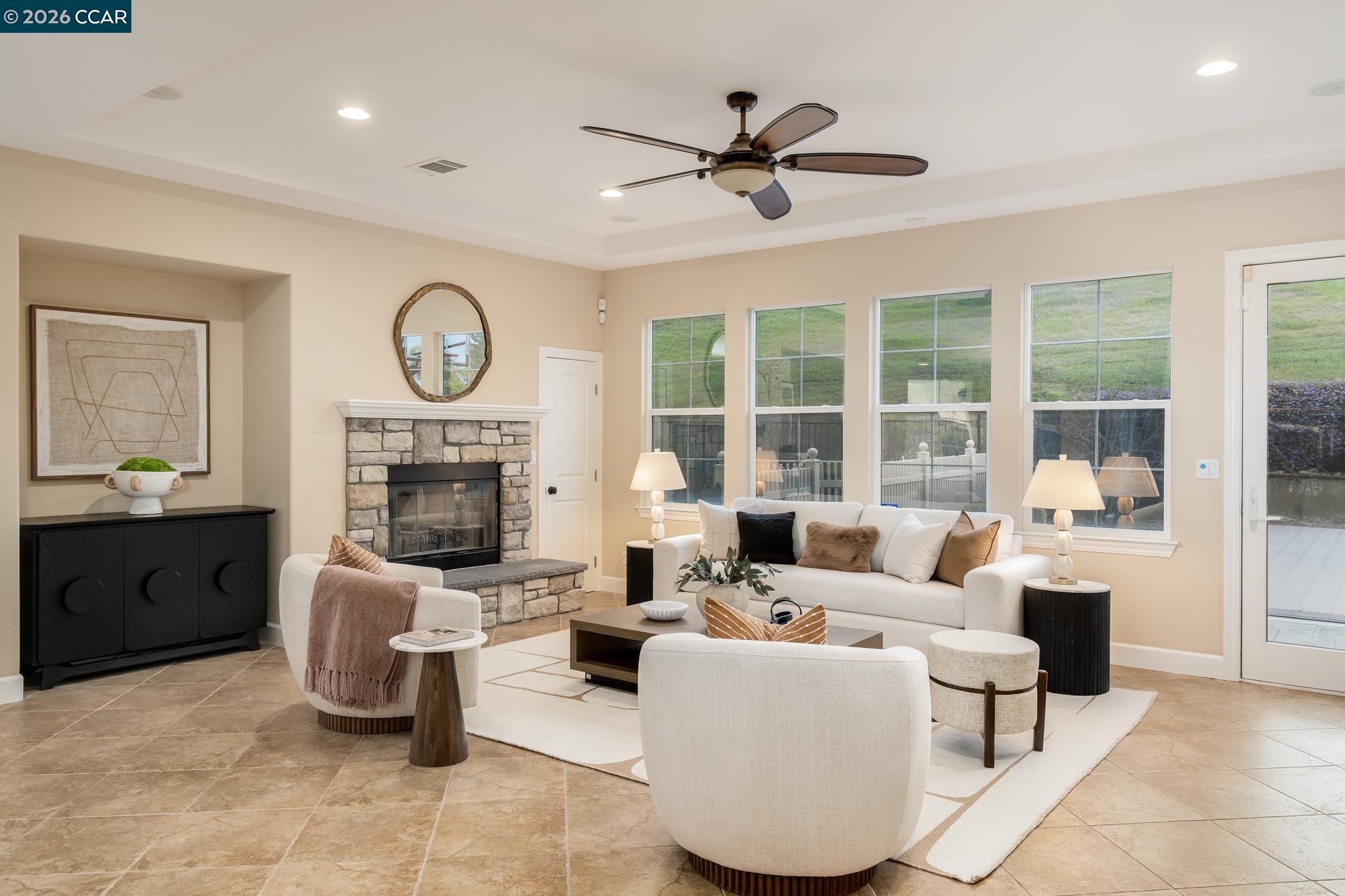 5058 Holborn Way San Ramon, CA 94582 - Photo 7 of 46 a living room with furniture a fireplace and a large mirror