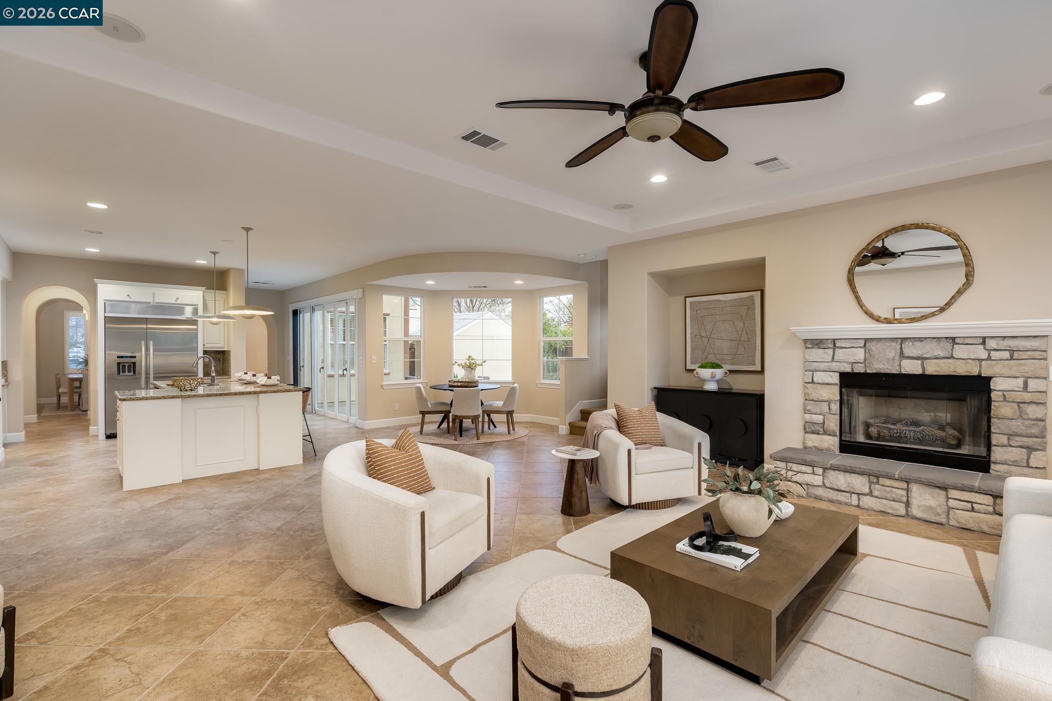 5058 Holborn Way San Ramon, CA 94582 - Photo 9 of 46 a living room with furniture a fireplace and a chandelier