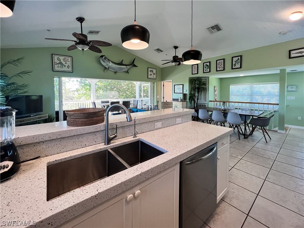 4510 Schooner Drive Upper Captiva, FL 33924 - Photo 15 of 48 a kitchen with stainless steel appliances granite countertop a sink and a microwave