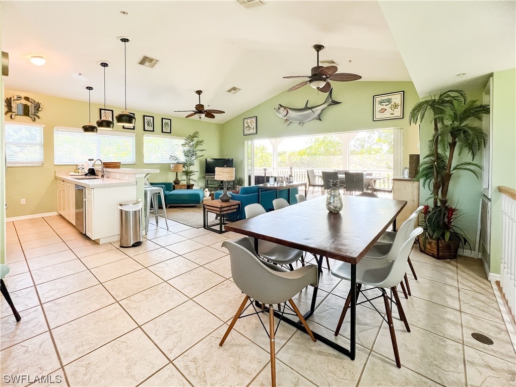 4510 Schooner Drive Upper Captiva, FL 33924 - Photo 18 of 48 a view of a dining room with furniture and chandelier
