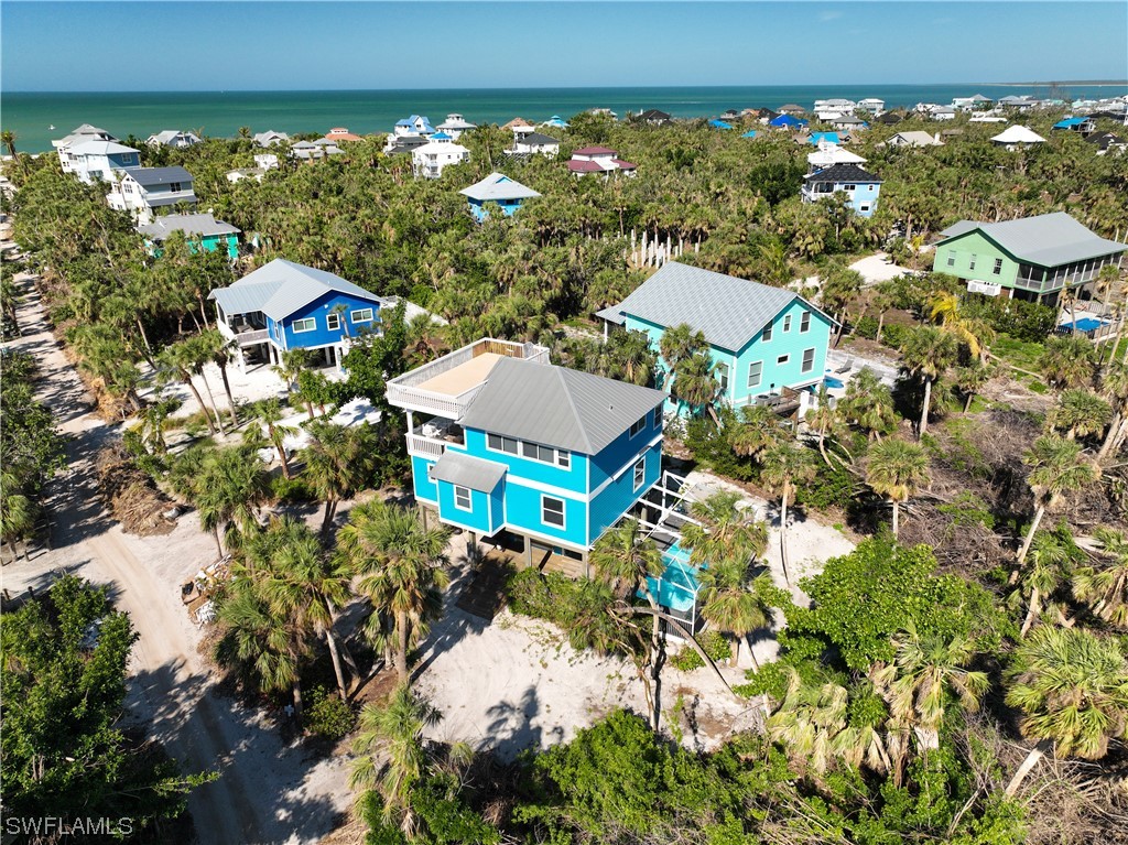 4510 Schooner Drive Upper Captiva, FL 33924 - Photo 2 of 48 a aerial view of a house with a yard swimming pool outdoor seating and yard