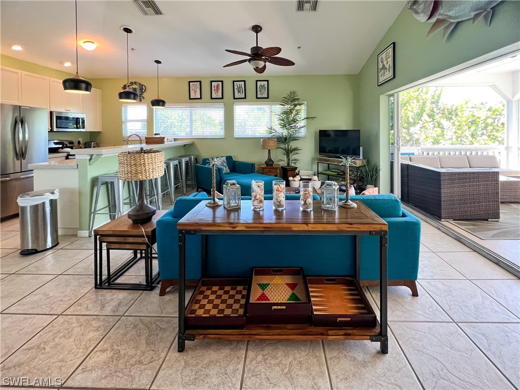 4510 Schooner Drive Upper Captiva, FL 33924 - Photo 22 of 48 a living room with furniture and a flat screen tv