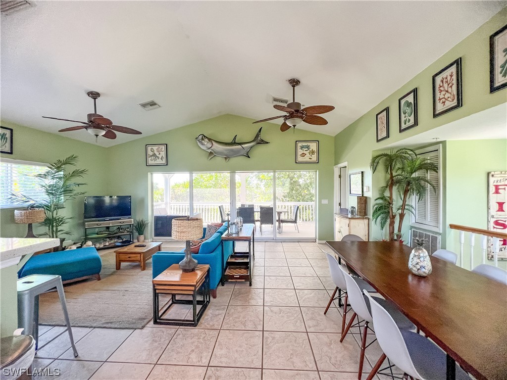 4510 Schooner Drive Upper Captiva, FL 33924 - Photo 23 of 48 a living room with furniture kitchen view and a large window