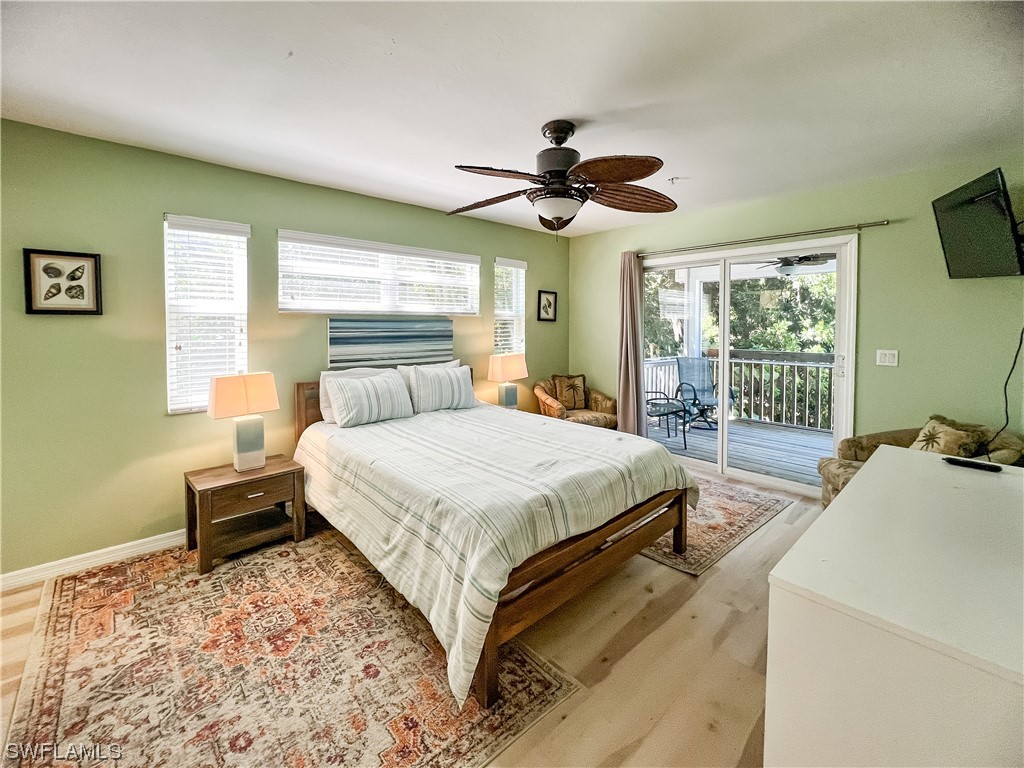 4510 Schooner Drive Upper Captiva, FL 33924 - Photo 25 of 48 a bedroom with a bed dresser and a window