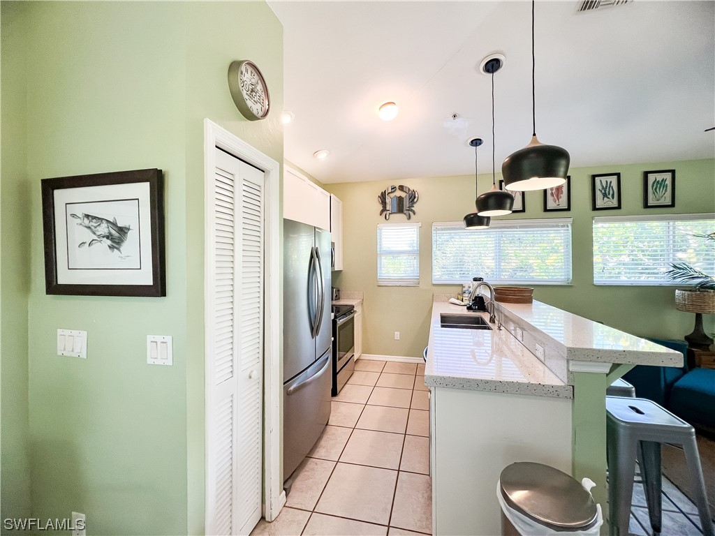4510 Schooner Drive Upper Captiva, FL 33924 - Photo 27 of 48 a living room with a table and chairs