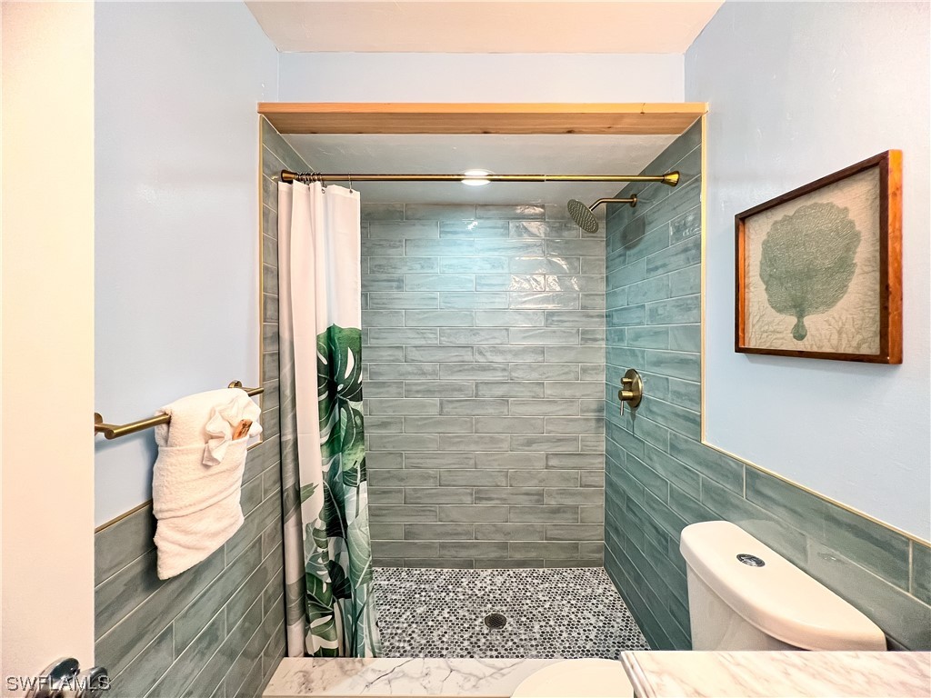 4510 Schooner Drive Upper Captiva, FL 33924 - Photo 32 of 48 a bathroom with a toilet and a shower