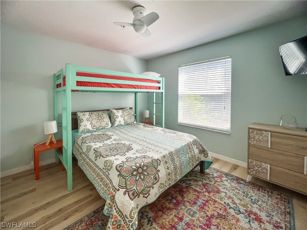 4510 Schooner Drive Upper Captiva, FL 33924 - Photo 35 of 48 a bedroom with a bed and a window