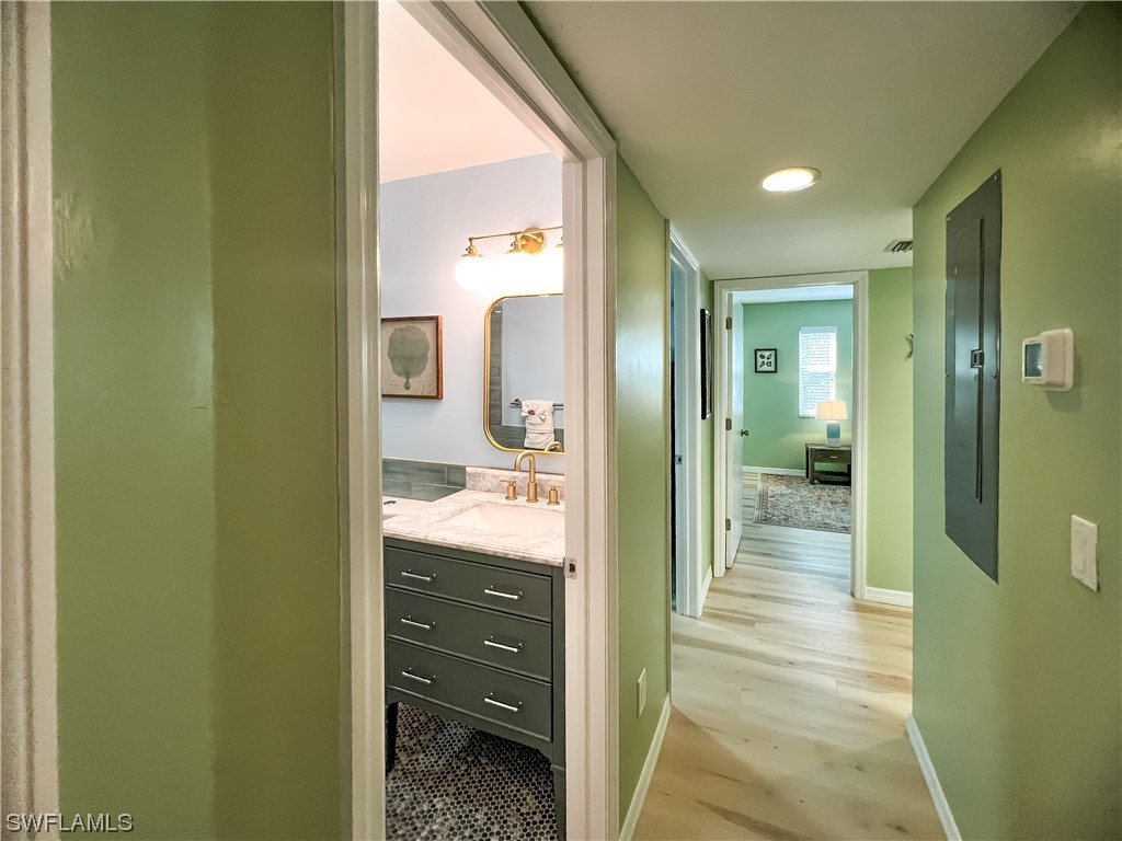 4510 Schooner Drive Upper Captiva, FL 33924 - Photo 36 of 48 a bathroom with a granite countertop sink and shower