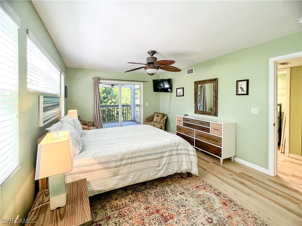 4510 Schooner Drive Upper Captiva, FL 33924 - Photo 38 of 48 a bedroom with bed and window