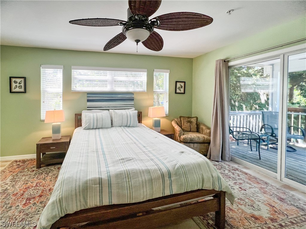 4510 Schooner Drive Upper Captiva, FL 33924 - Photo 39 of 48 a bedroom with a large bed and a window
