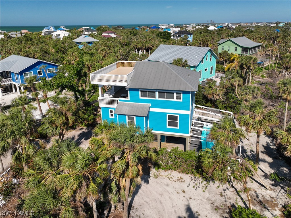 4510 Schooner Drive Upper Captiva, FL 33924 - Photo 4 of 48 an aerial view of a house with a yard
