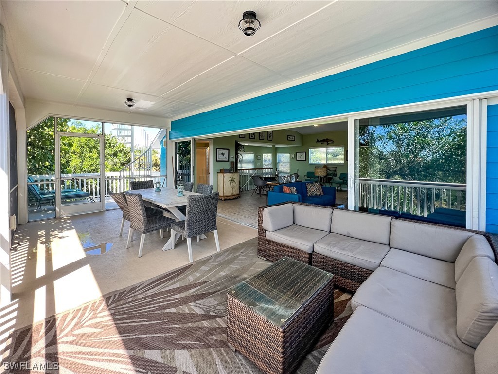 4510 Schooner Drive Upper Captiva, FL 33924 - Photo 43 of 48 a living room with furniture and a large window