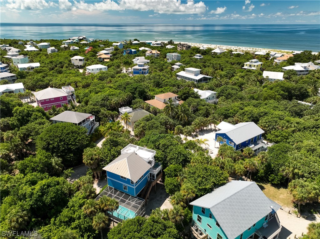4510 Schooner Drive Upper Captiva, FL 33924 - Photo 8 of 48 a view of a house with a yard
