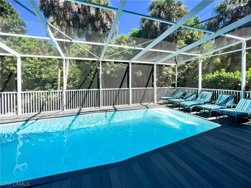 4510 Schooner Drive Upper Captiva, FL 33924 - Photo 9 of 48 a view of a backyard with a patio and wooden fence