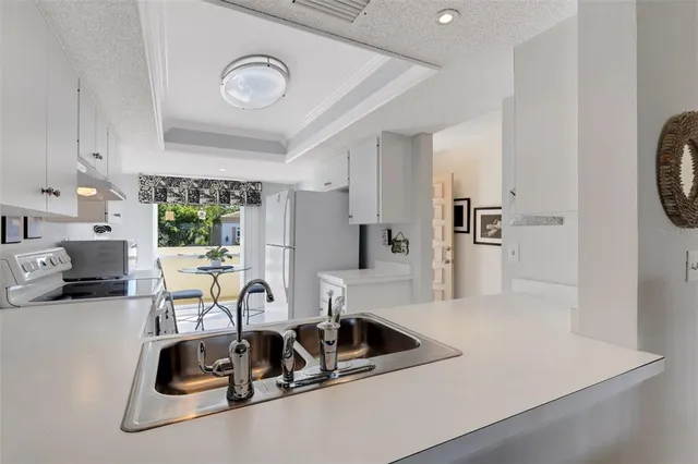 a view of a workspace with a table and chair