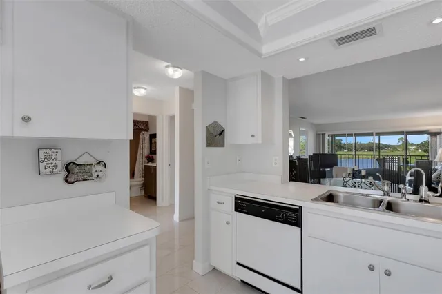 a kitchen with a sink and a refrigerator
