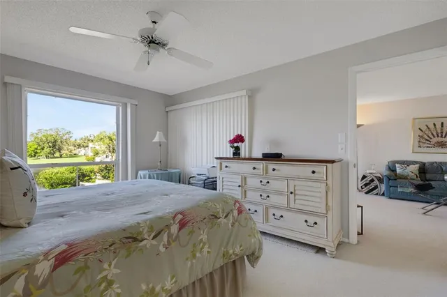 a bedroom with a bed and a lamp