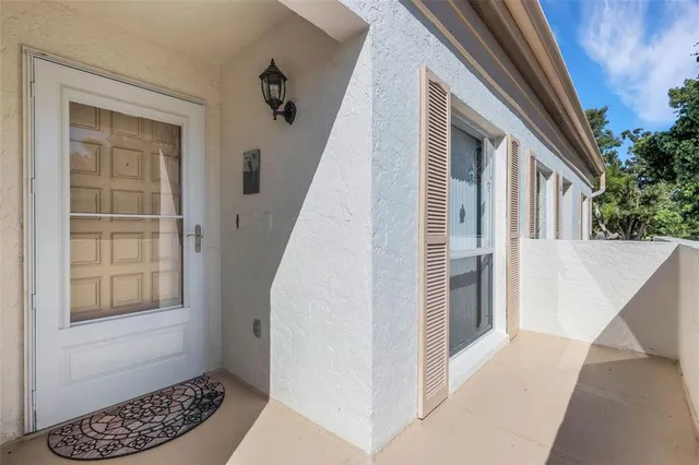 a view of entryway with wooden floor and stairs