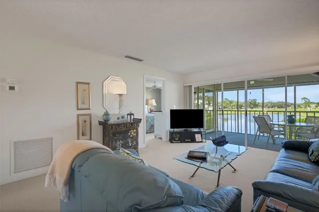 a large bedroom with a large bed and a flat screen tv