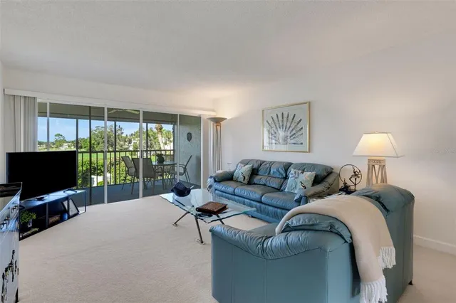 a living room with furniture and a lamp