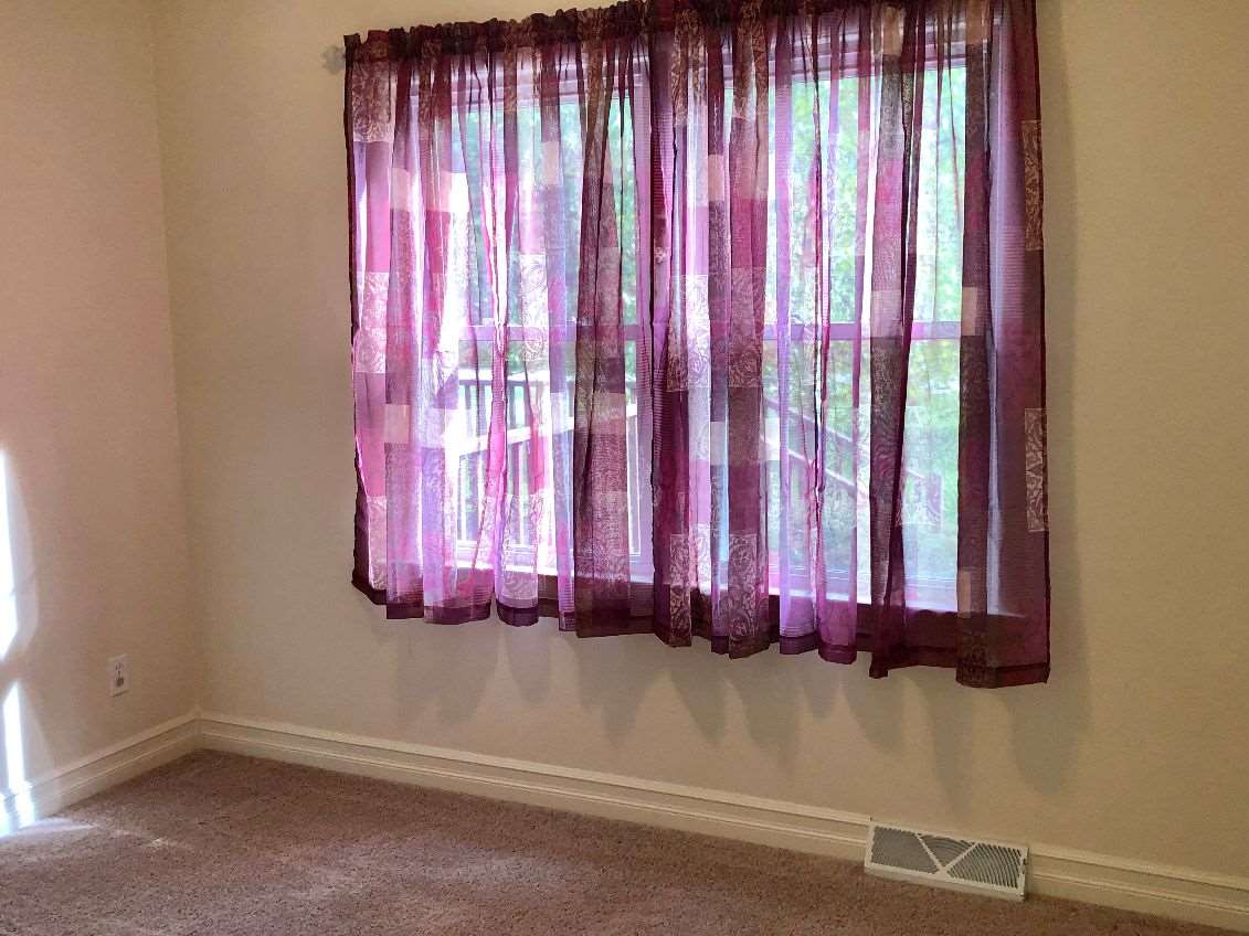 5206 North Woodburn Road Byron, IL 61010 - Photo 12 of 25 a view of a window and a chair