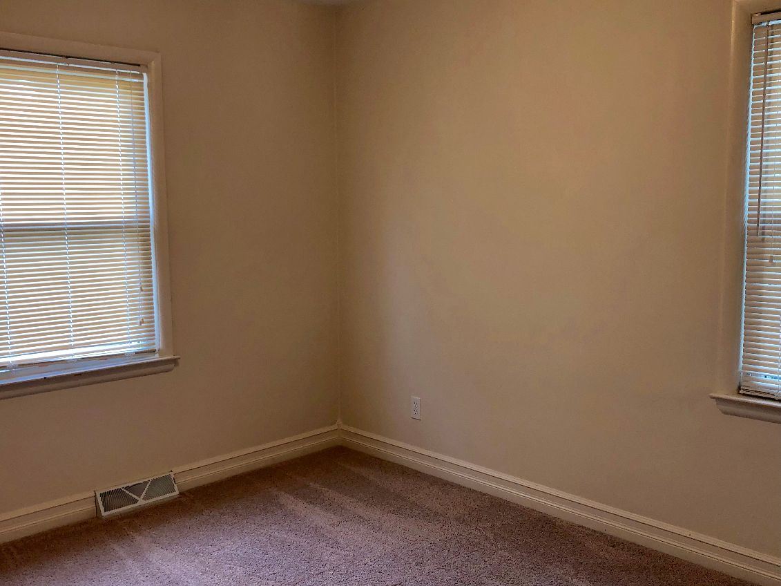 5206 North Woodburn Road Byron, IL 61010 - Photo 13 of 25 an empty room with a window