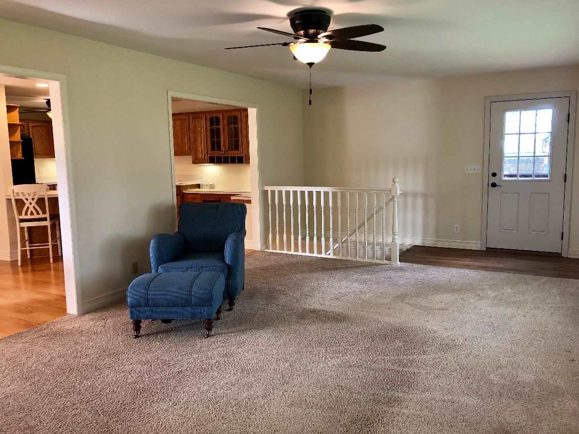 5206 North Woodburn Road Byron, IL 61010 - Photo 3 of 25 a living room with furniture and a window