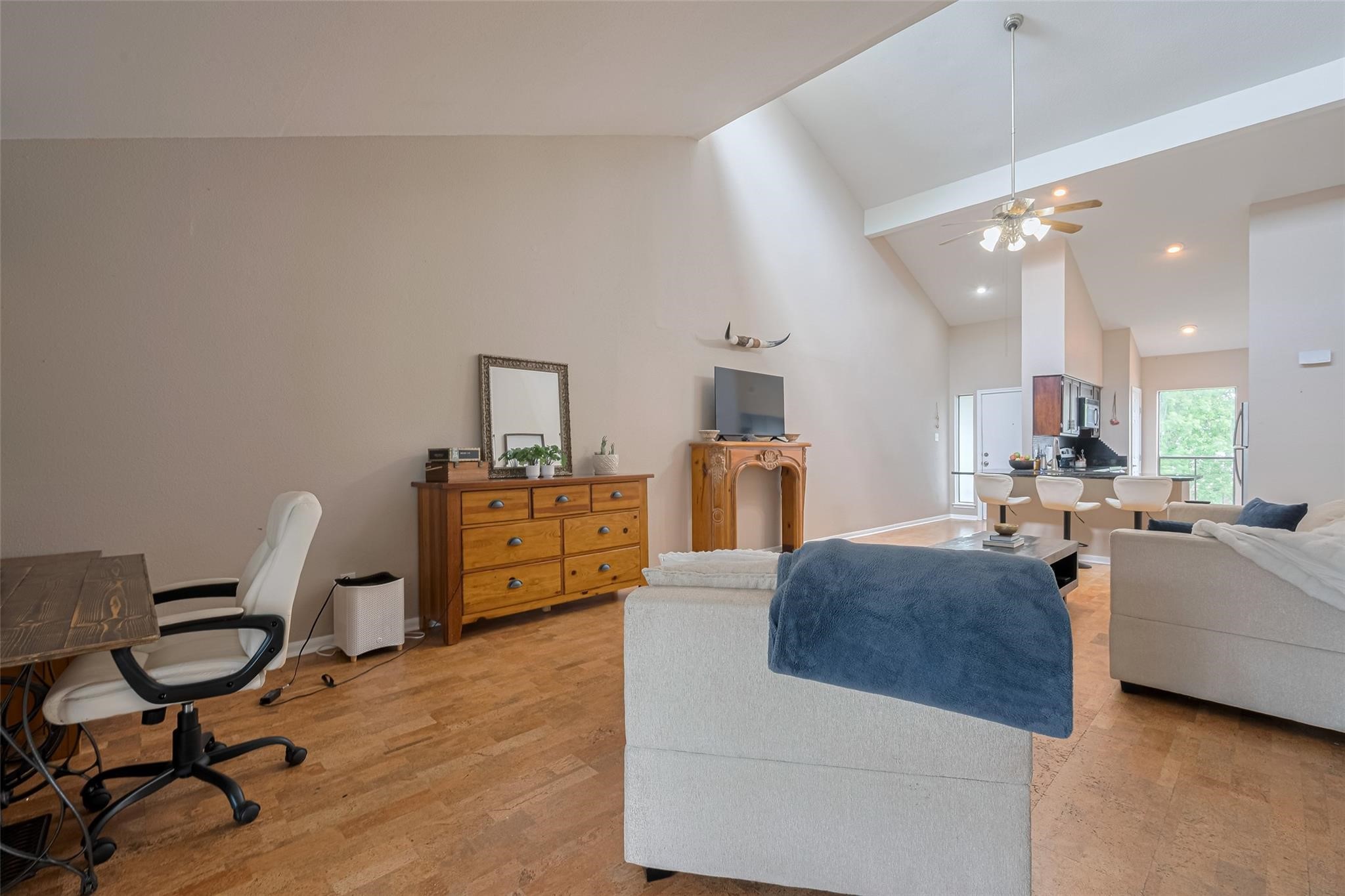 182 April Point Drive North Conroe, TX 77356 - Photo 4 of 18 a living room with furniture a flat screen tv and kitchen view
