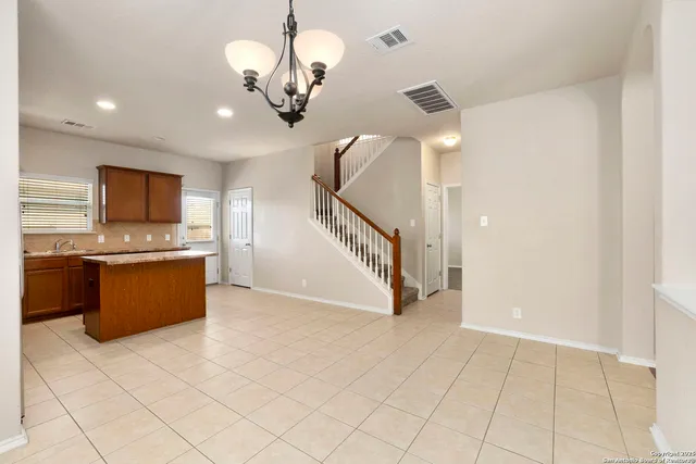 a view of a kitchen with a sink and dishwasher
