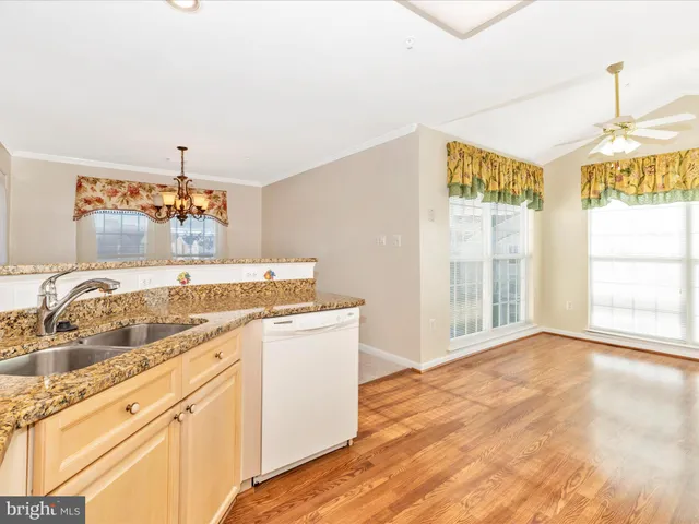 a view of a kitchen sink and a window
