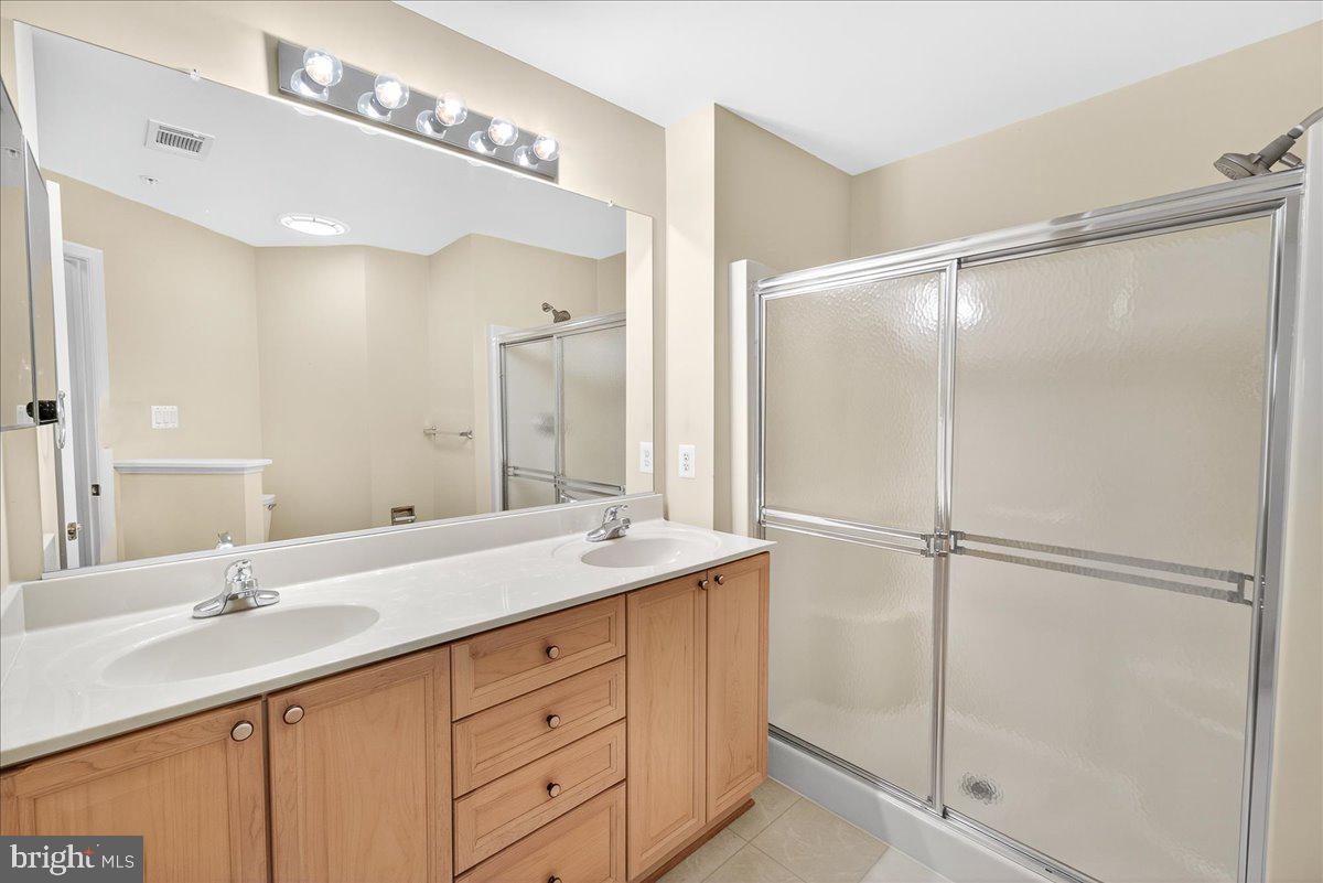 2509 Shelley Circle, Unit 5 3A Frederick, MD 21702 - Photo 27 of 47 a bathroom with a sink double vanity and a mirror