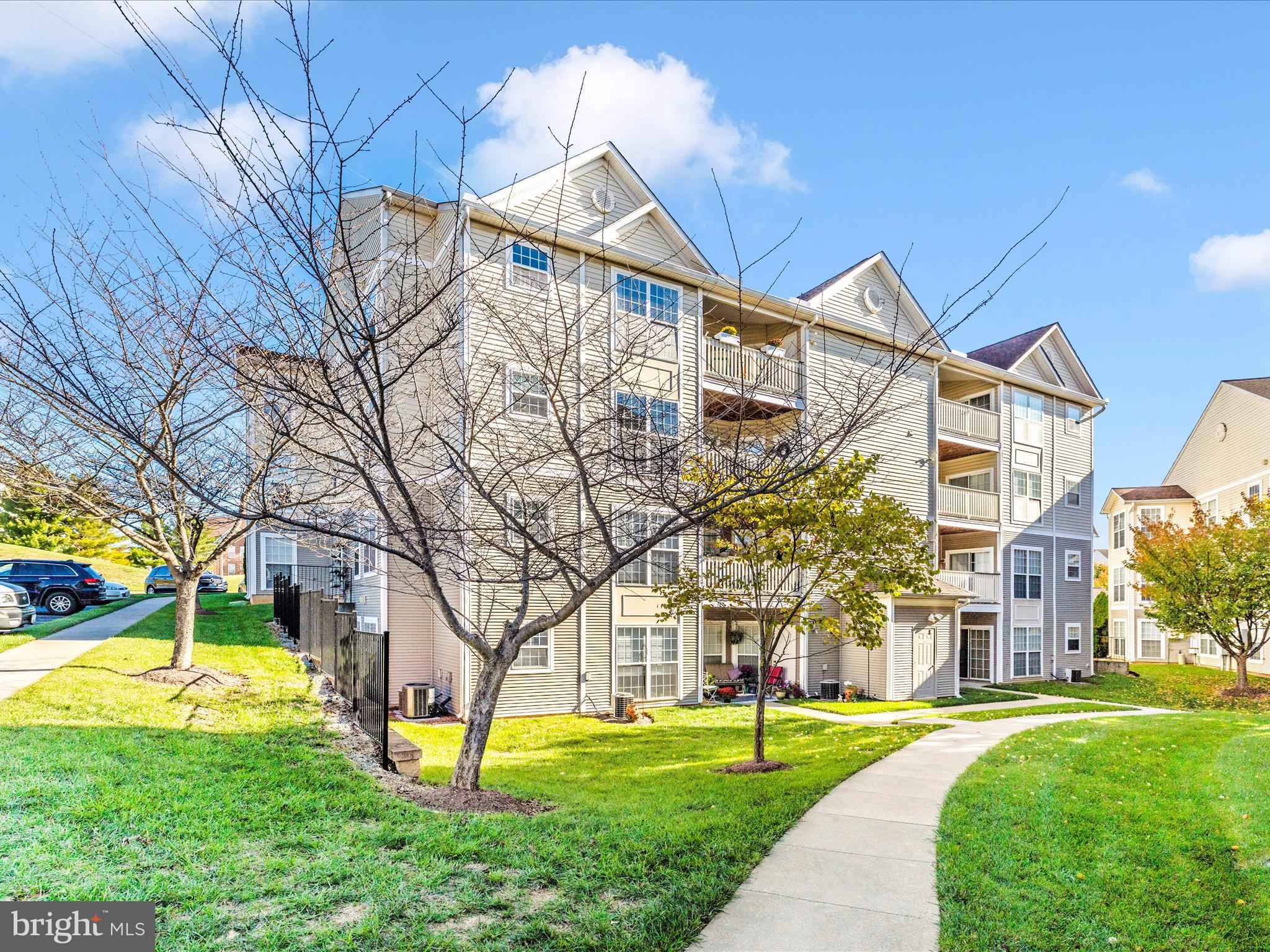 2509 Shelley Circle, Unit 5 3A Frederick, MD 21702 - Photo 34 of 47 a front view of a house with a yard and a tree