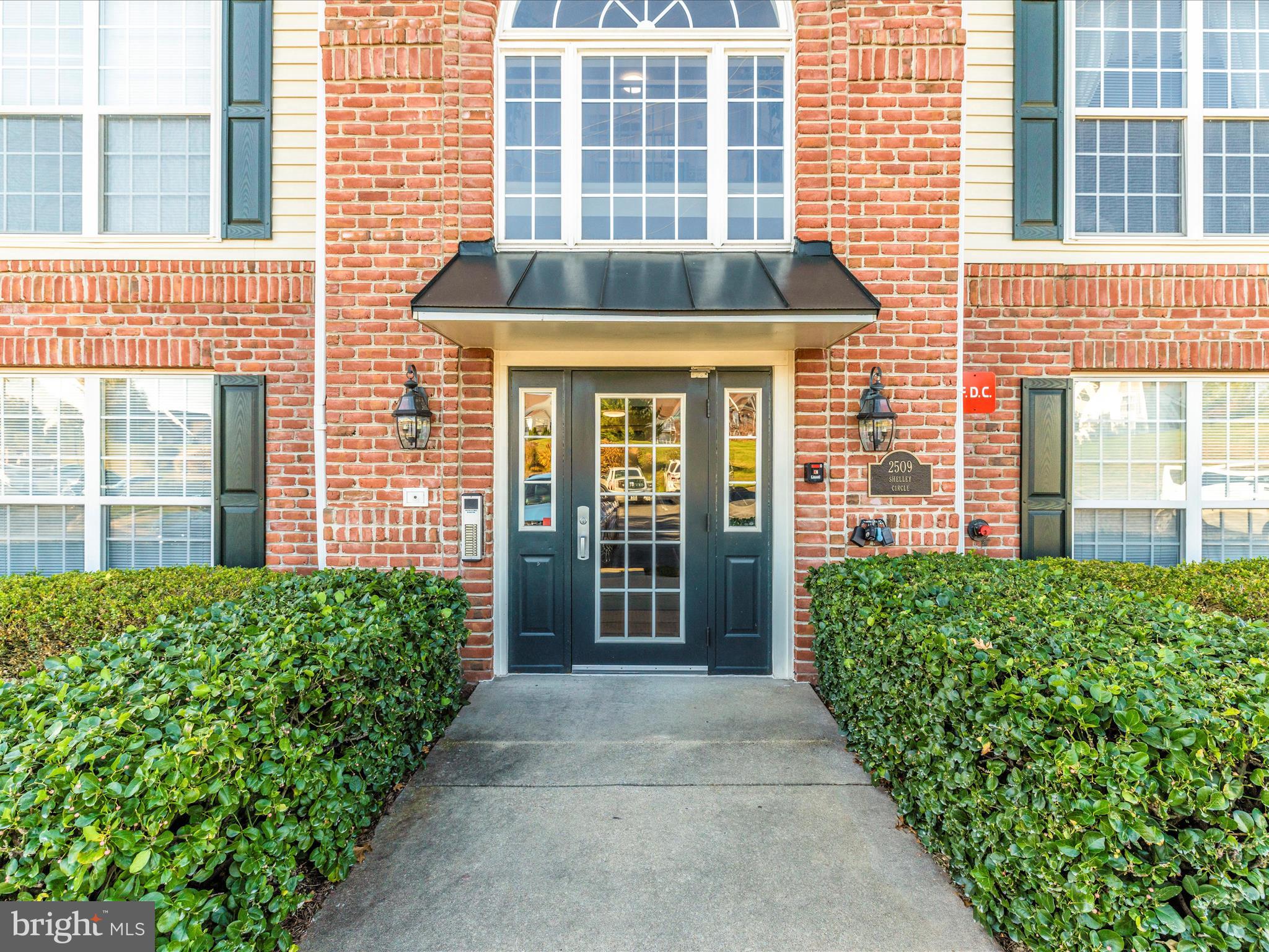 2509 Shelley Circle, Unit 5 3A Frederick, MD 21702 - Photo 6 of 47 a view of a brick house with large windows