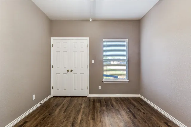 a front view of house with yard and swimming pool