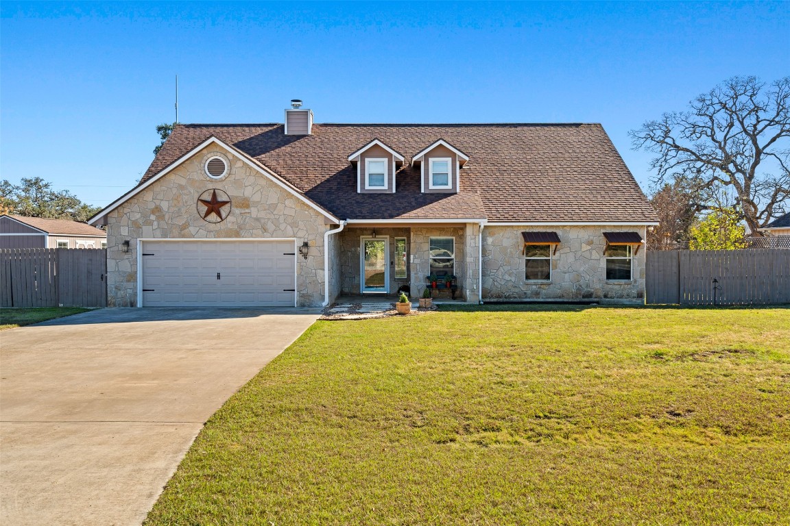1536 Kings Ranch Road Bandera, TX 78003 - Photo 3 of 35 a front view of a house with a yard