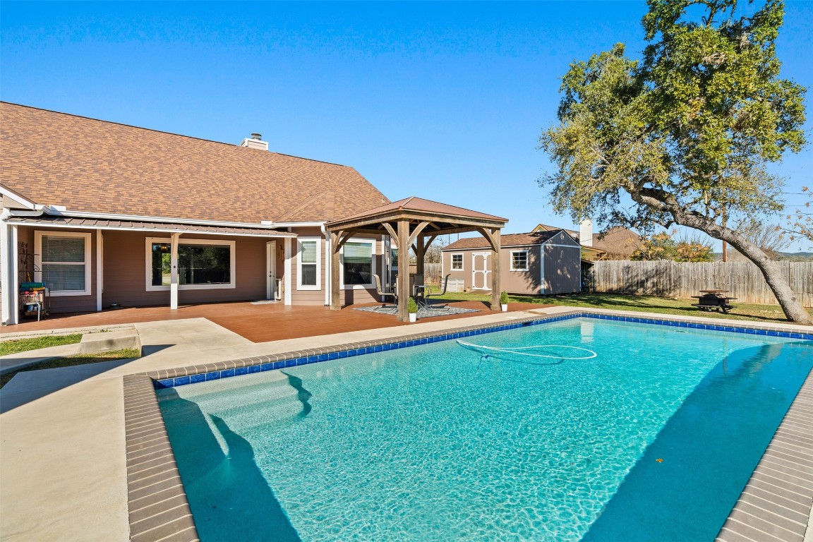 1536 Kings Ranch Road Bandera, TX 78003 - Photo 32 of 35 a front view of house with yard and swimming pool