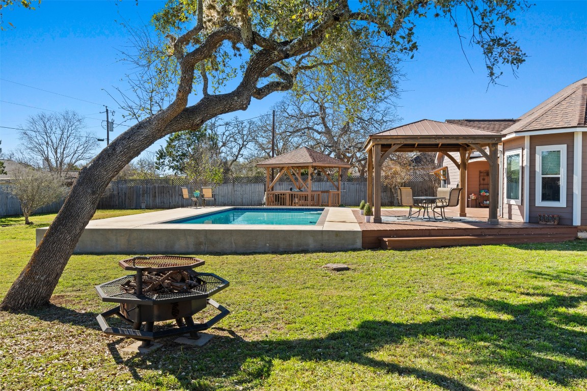 1536 Kings Ranch Road Bandera, TX 78003 - Photo 4 of 35 a view of a swimming pool with a patio