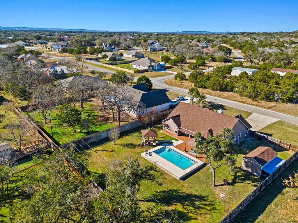 1536 Kings Ranch Road Bandera, TX 78003 - Photo 6 of 35 an aerial view of residential houses with outdoor space and swimming pool