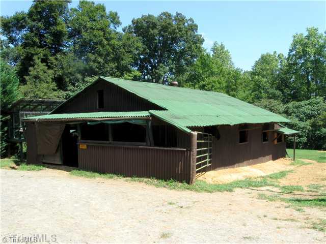 5120 Quick Ruffin, NC 27326 - Photo 6 of 16 Stable/Barn. 3 stall barn with hay loft,hay room,tac room/feed room. Wired and the water